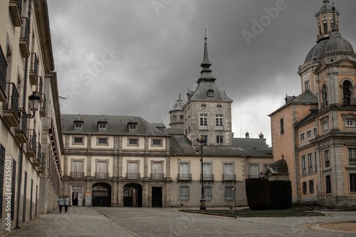 Ancient La Granja de San Ildefonso royal palace in San Ildefonso, Spain against a clouded sky