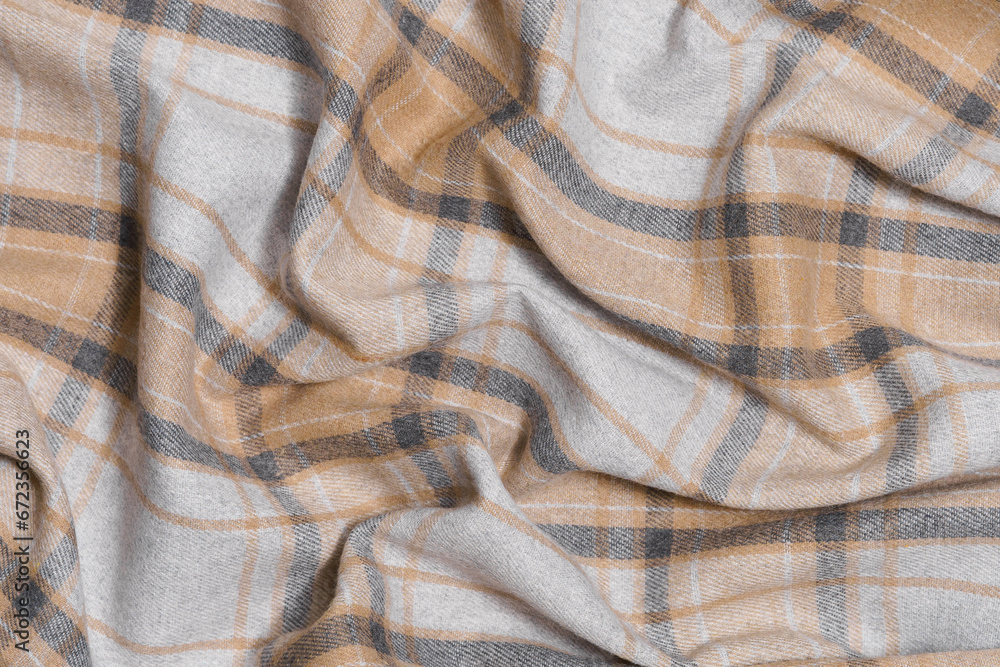 Texture of crumpled warm fabric of beige and gray taratan color. Traditional Scottish clothing. Image for your design Texture of crumpled warm fabric of beige and gray taratan color. Traditional Scottish clothing. Image for your design