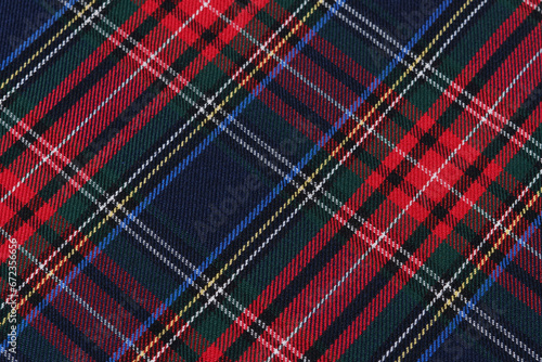 close-up texture tartan scottish style checkered fabric green, red and blue colors tilted. Image for your design