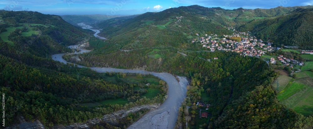 A panoramic aerial view of the Enza River near the village of Vetto d'Enza and the Vetto Dam. Reggio Emilia, Emilia Romagna, Italy