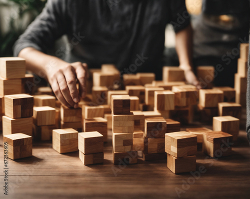 person placing wooden blocks