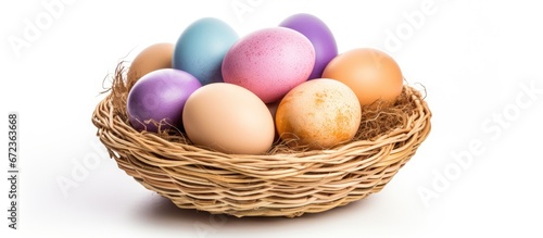 A white background features an isolated Easter egg resting inside a basket