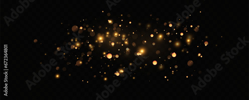 Golden sequins glow with many lights. Glittering dust. Luxurious background of golden particles.	