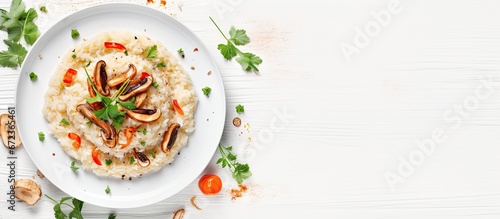Chicken fillet and vegetables combined with risotto presented from a bird s eye perspective with abundant white space available for use