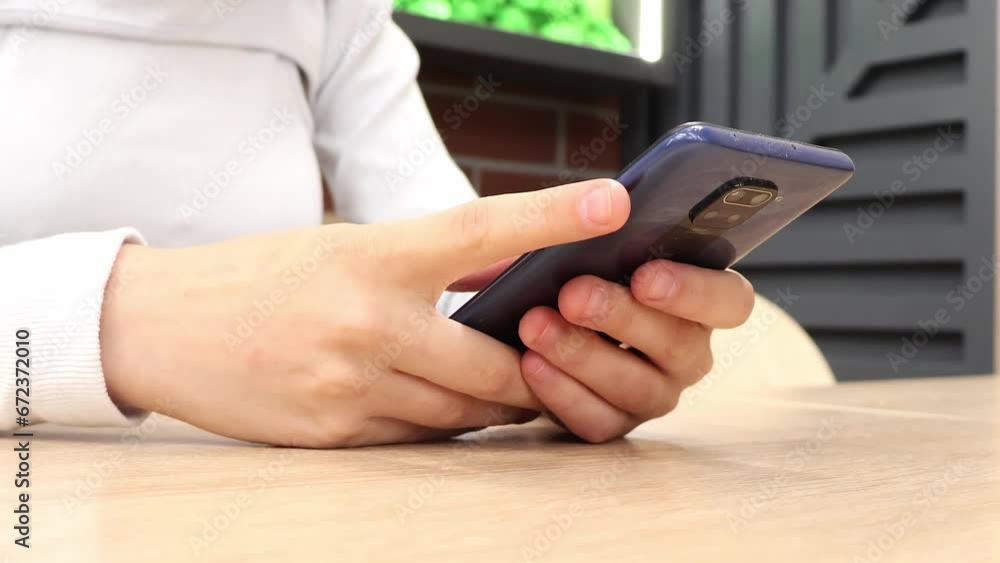 close up of a person using a mobile phone close up of a person using a mobile phone