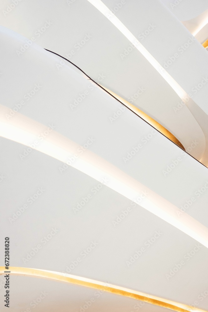 Modern architectural building illuminated by bright lights, creating a stunning visual effect Modern architectural building illuminated by bright lights, creating a stunning visual effect