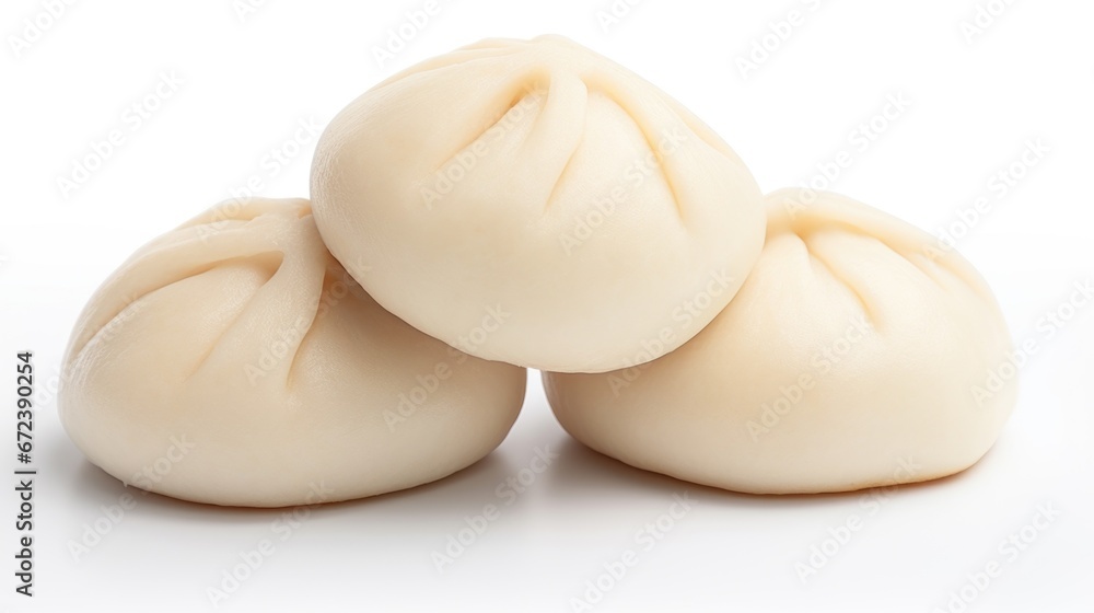A pile of dumplings sitting on top of each other, bao buns. A pile of dumplings sitting on top of each other, bao buns.