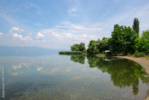 Fototapeta Naklejka Na Ścianę i Meble -  Fishing boat on the lake. Blue lake landscape. Iznik, Bursa, Turkey.