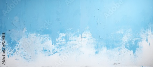 An example showcasing the application of a pale blue coating onto a vertical surface
