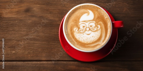 Cup of latte cappuccino coffee with Santa Claus shape art on foam, top view. Christmas and New Year background with copy space.
