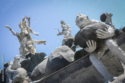 Bali - staue of Gods and slaves photo