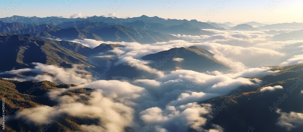 Beautiful view above the clouds with bright blue Sky and white clouds.as a nature concept. Sunny weather for summer.