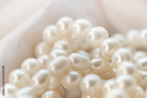 The soft focus pearls on a white canvas evoke a sense of calm and timeless beauty. This tranquil scene provides a respite from the relentless pursuit of the ultra-modern aesthetics.