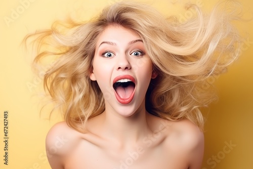 Excited blonde woman with soft skin promoting beauty product. photo