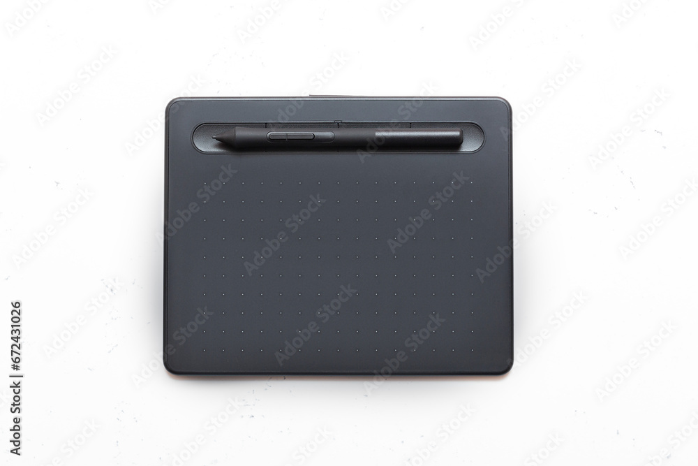Top view of graphic tablet and pen for illustrators, designers and photographers on light
background. 3d rendering Top view of graphic tablet and pen for illustrators, designers and photographers on light
background. 3d rendering