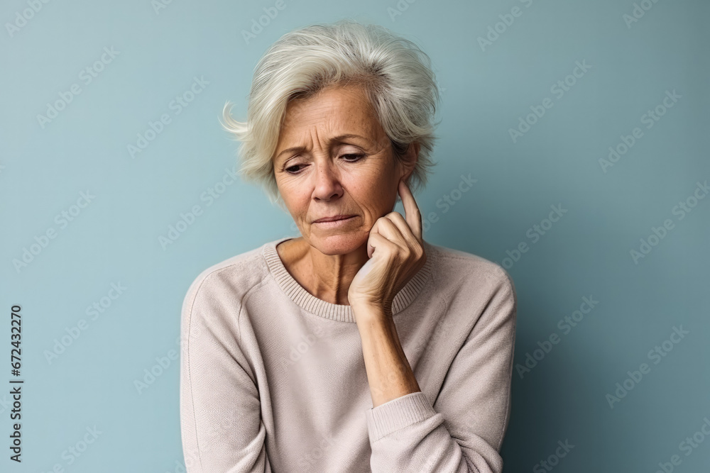 Patient showing signs of despair in a hospital room isolated on a gradient background Patient showing signs of despair in a hospital room isolated on a gradient background