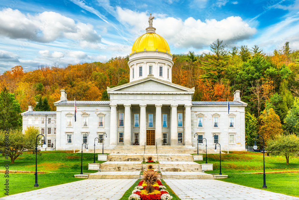 Frontal view of Vermont State House, in Montpelier, VT with fall foliage colors. This capitol is a public building and the seat of the Vermont General Assembly.