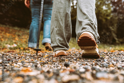 Nordic Walking in Autumn forest, hiking teenage girl