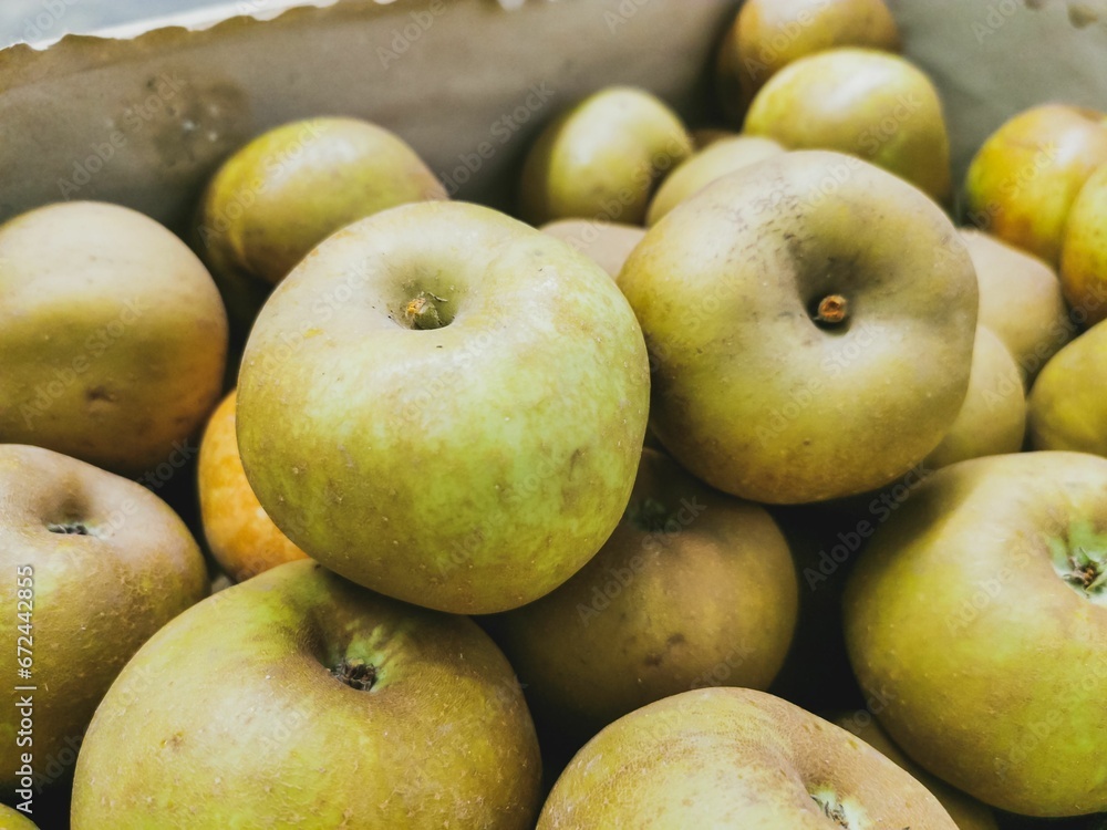 Close up of reinette grise du canada apples in wooden crates. Prepared for sale. Wooden box Close up of reinette grise du canada apples in wooden crates. Prepared for sale. Wooden box