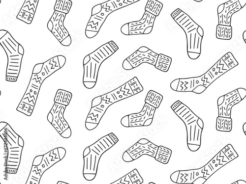 Seamless pattern with contour drawn sock. Doodle knitted warm element of clothing. Different funny line drawn texture socks