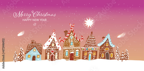 Christmas greeting card with gingerbread houses covered in snow and falling stars in pink sky.