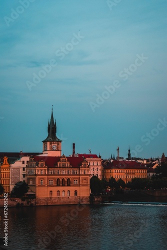Majestic building set atop a hill overlooking a tranquil river in Praha, Czech Republic