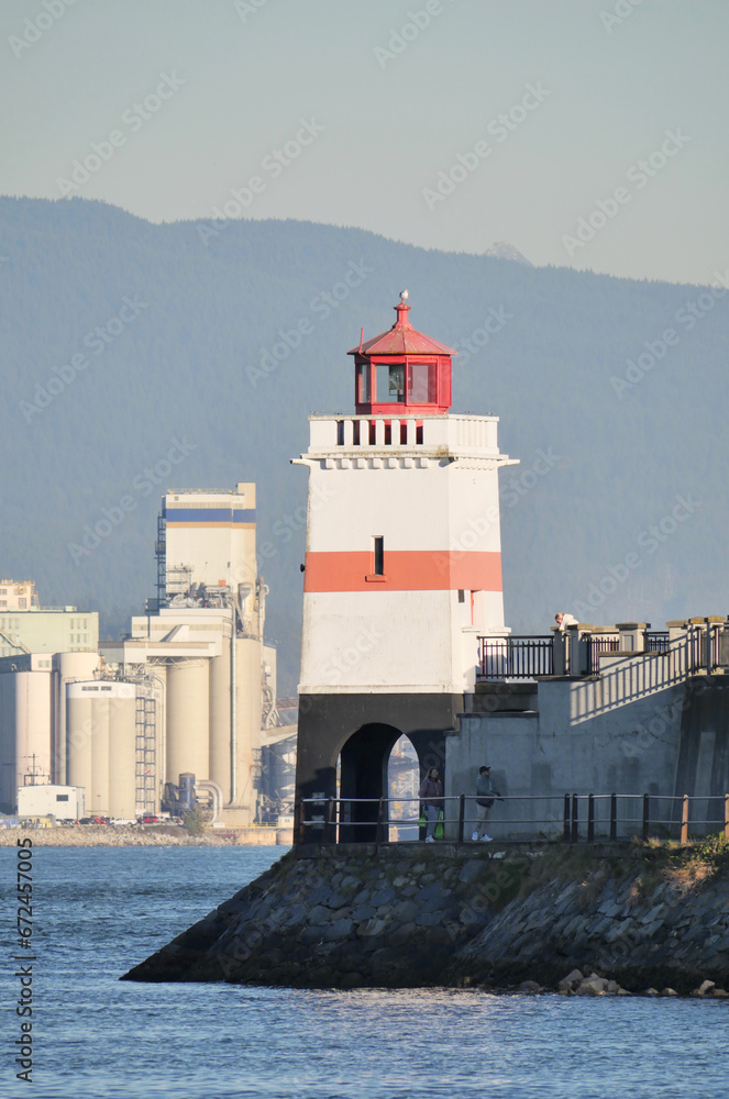 Beautiful view of the Brockton Point Lighthouse at Stanley Park during a fall season in Vancouver, British Columbia, Canada