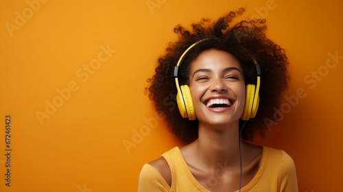 Smiling woman in headphones, yellow background, happy african american woman