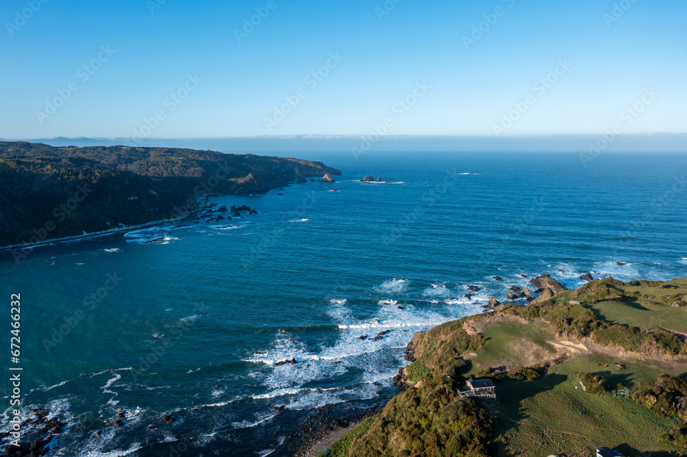 Aerial View of a Waves Coming Into a Bay out in the Pacific on Chiloe Island in Northern Patagonia Chile