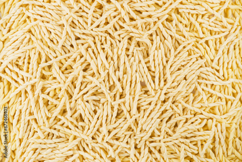Dry pasta closeup uncooked on background photo