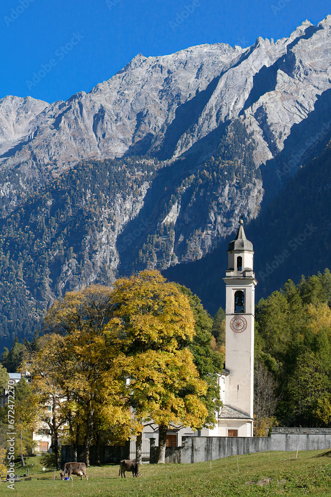 Mountain village of Soglio with its historic church, San Lorenzo, during autumn season. Soglio is located in the Bregaglia valley in the Maloja district of Switzerland.