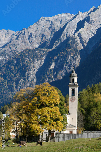 Mountain village of Soglio with its historic church, San Lorenzo, during autumn season. Soglio is located in the Bregaglia valley in the Maloja district of Switzerland.