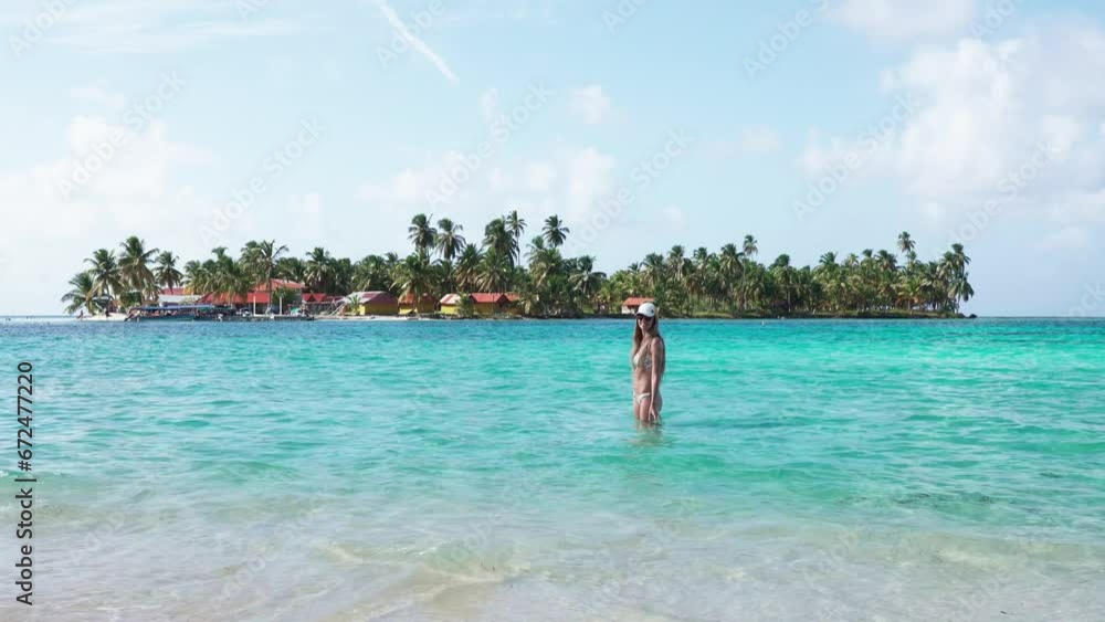 Woman inside turquoise waters of the sea Woman inside turquoise waters of the sea