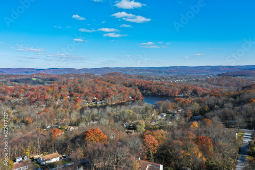 Wantage NJ and Lake Neepaulin on a sunny autumn day with fall foliage aerial 