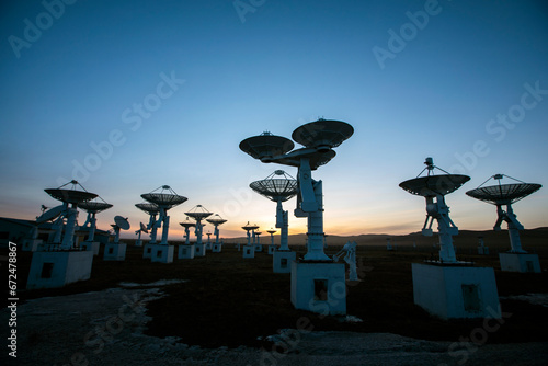 The silhouette of a radio telescope