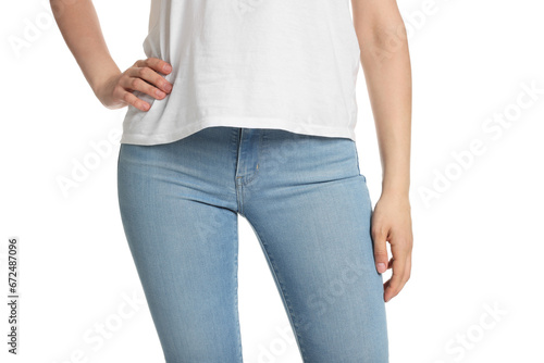Woman wearing stylish light blue jeans on white background, closeup
