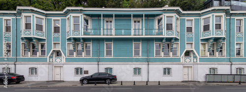 T.C. Cumhurbaskanligi Yatirim Ofisi, or Turkish Presidency Investment Office, a Neoclassical style blue and white wooden building located in Muallim Naci Street, Ortakoy, Besiktas, Istanbul, Turkey photo