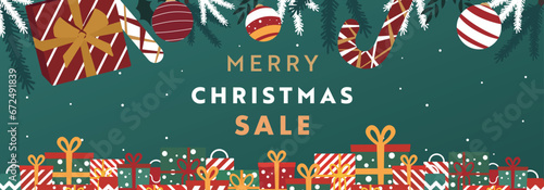 プレゼントボックスやオーナメント、キャンディーで飾られたクリスマス背景バナーテンプレート（緑）　Christmas background banner template decorated with gift boxes, ornaments and candies (green)