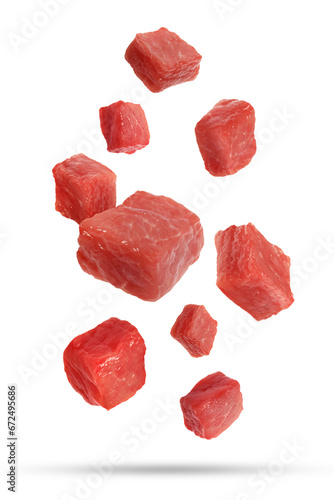 Pieces of raw beef for goulash falling on white background