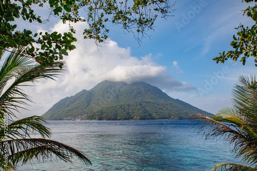 View of the volcanic Hiri island from Jikomalamo beach in the island of Ternate - both belonging to the Maluku archipelago in Indonesia