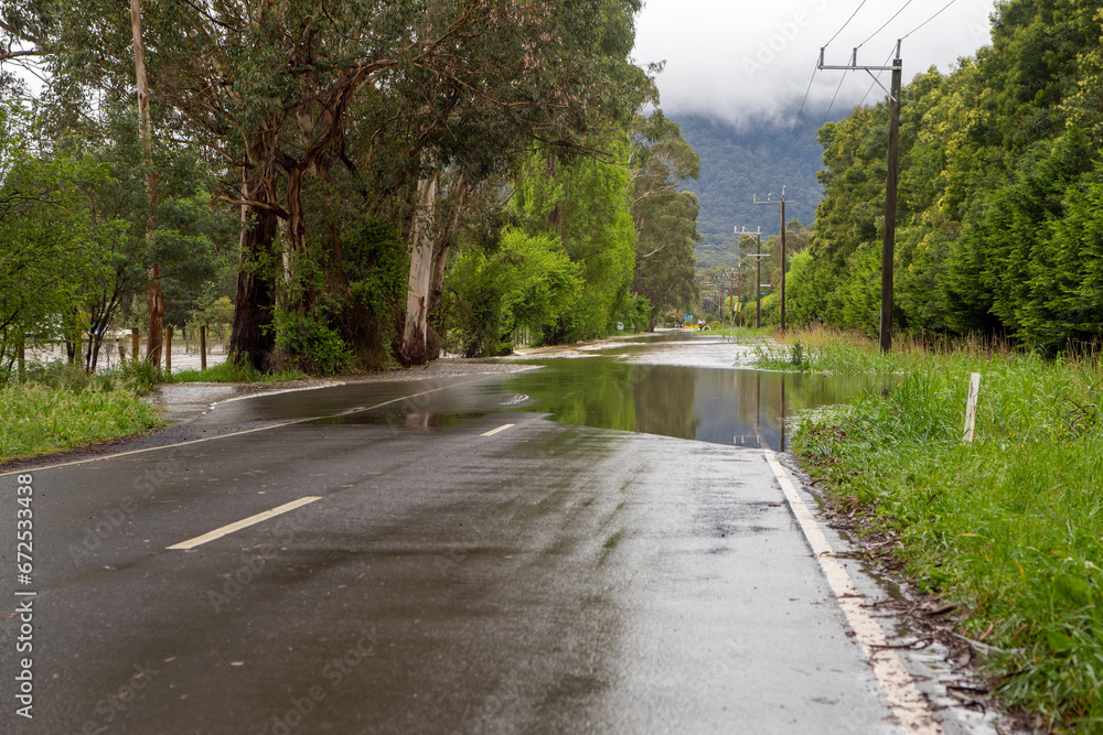 Flood Water over a country road in Warburton, Victoria Australia 2023 Flood Water over a country road in Warburton, Victoria Australia 2023