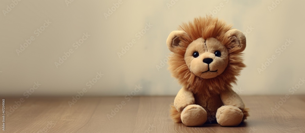 Fototapeta premium Tiny lion toy for your mobile photos