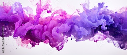 Watercolor in abstract style with splashes of color on a black background The paper is adorned by vibrant purple splashes of watercolor paint creating beautiful stains