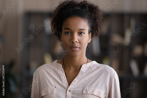 Head shot portrait of serious young African American woman, beautiful Black student girl in casual looking at camera. Millennial entrepreneur, modern female startup business leader profile picture