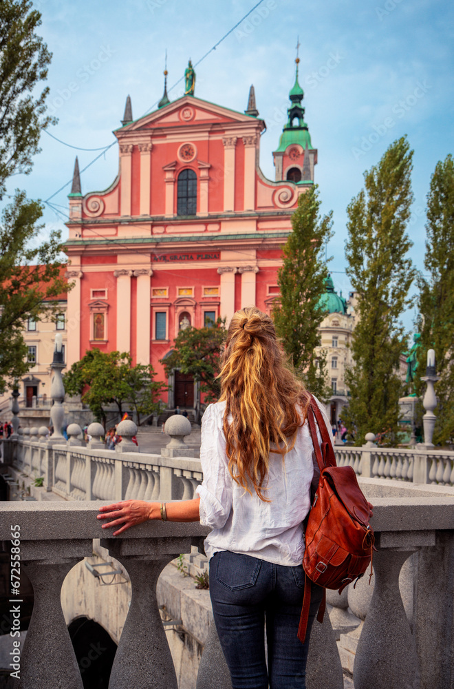 Obraz na płótnie Rear view of woman visiting Ljubljana, capital city of Slovenia w salonie