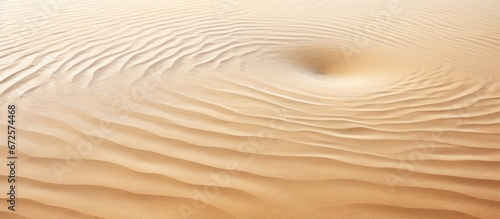 Water generates ripples in the sand