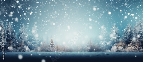 The forest in the winter has a blurry background with snowflakes and a bokeh effect photo