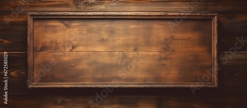 Wooden background with a photo or painting frame