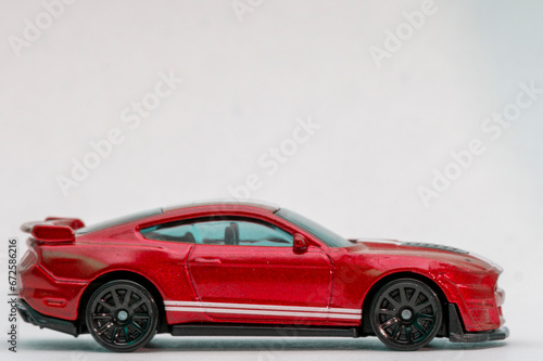 Toy red sportcar on a white background photo