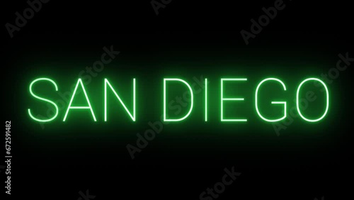 Flickering neon green glowing san diego sign animated black background. photo
